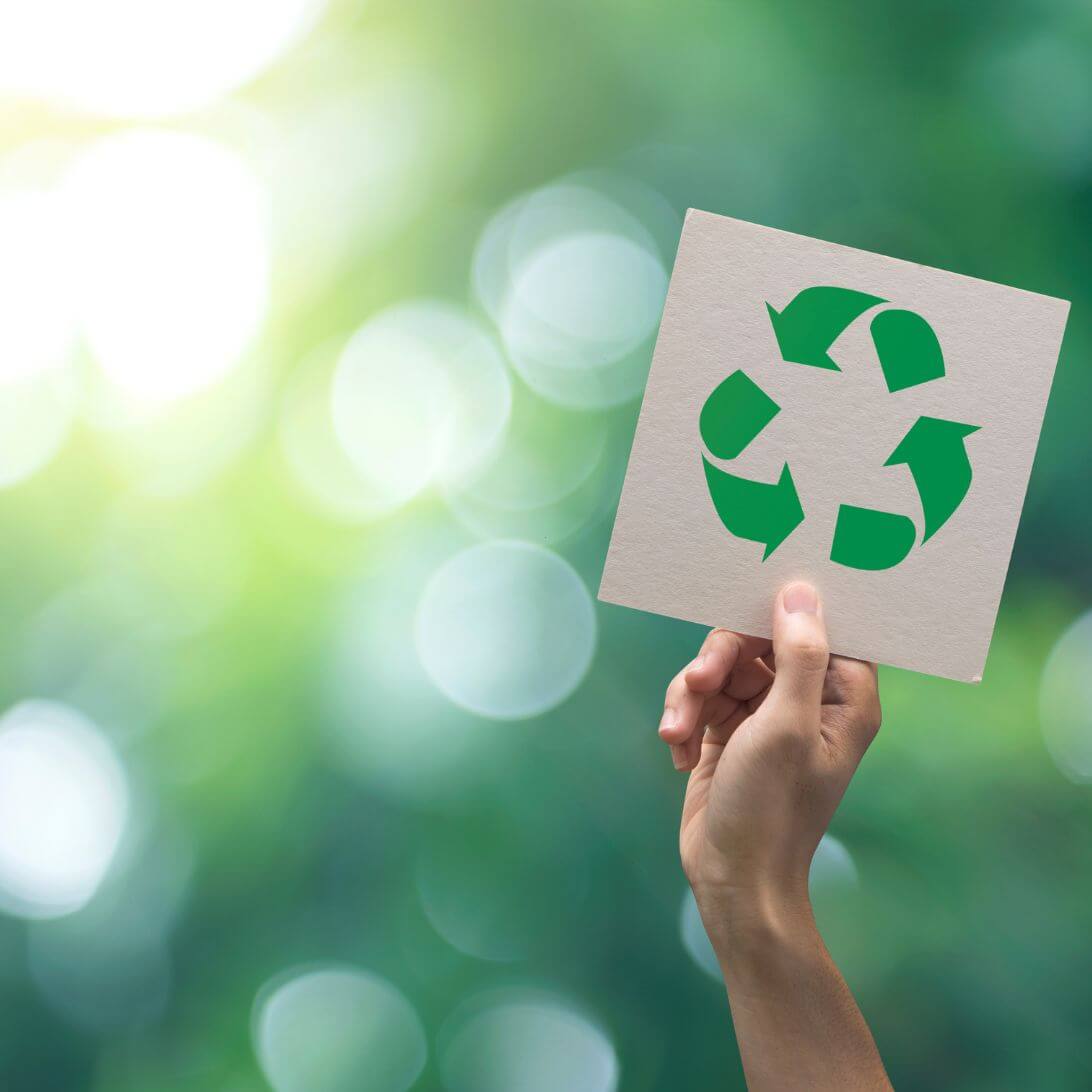 Bordje met groen recycling-teken